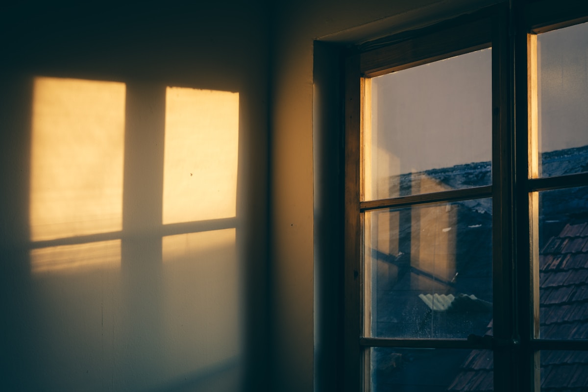 Soft morning sunlight streaming through the windows of a home, a hopeful image of recovery happening one day at a time
