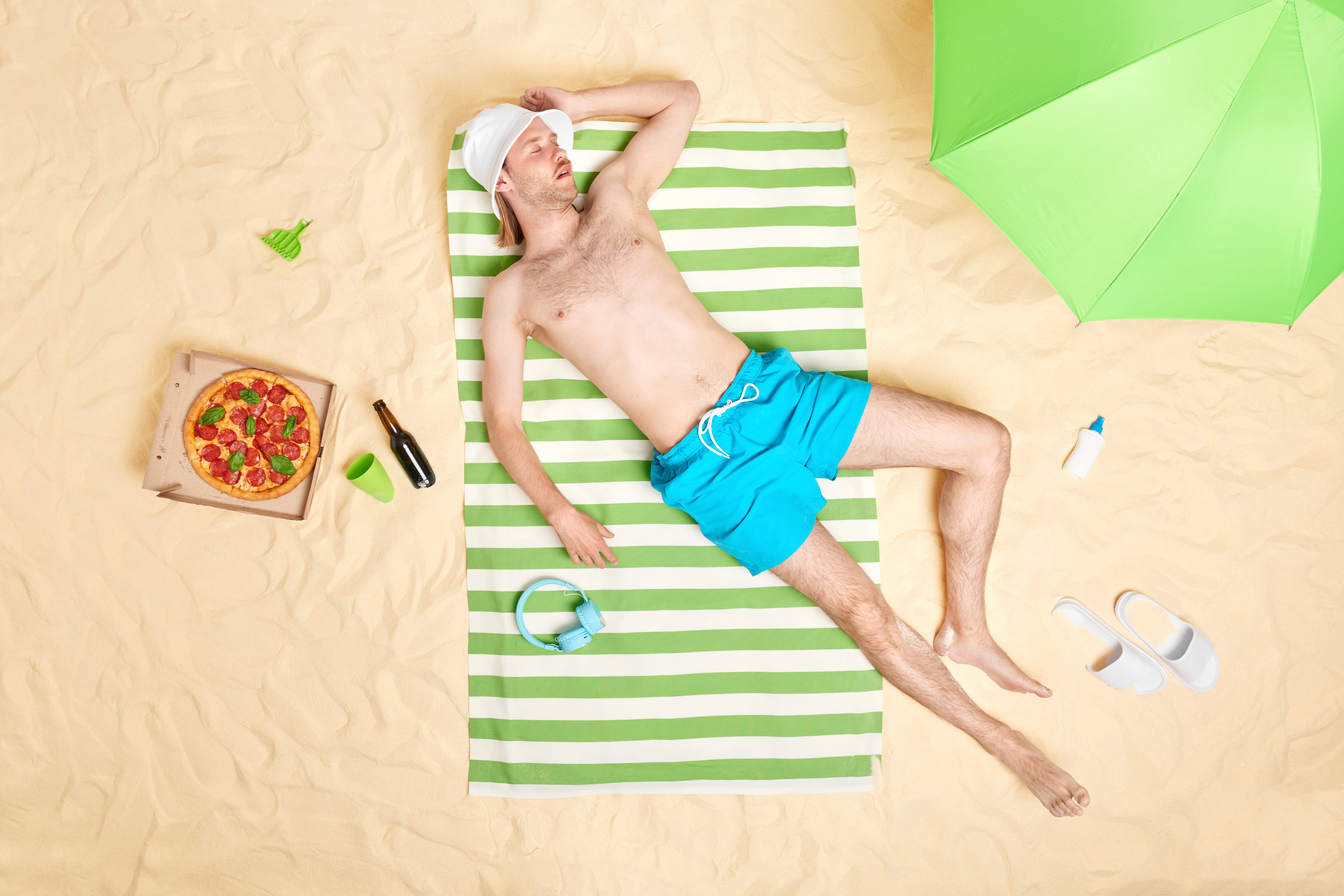 man taking a break on the beach 