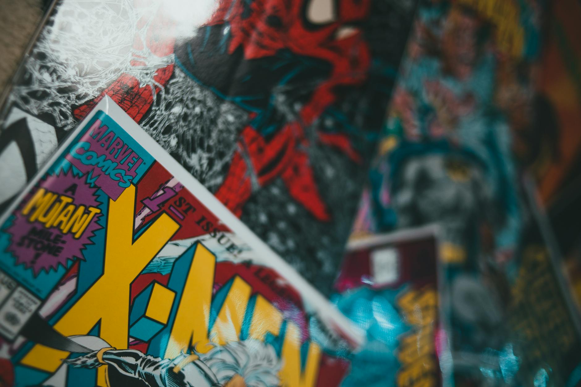 Close-up of a child's hands holding a vibrant, action-packed graphic novel with speech bubbles and comic panels.