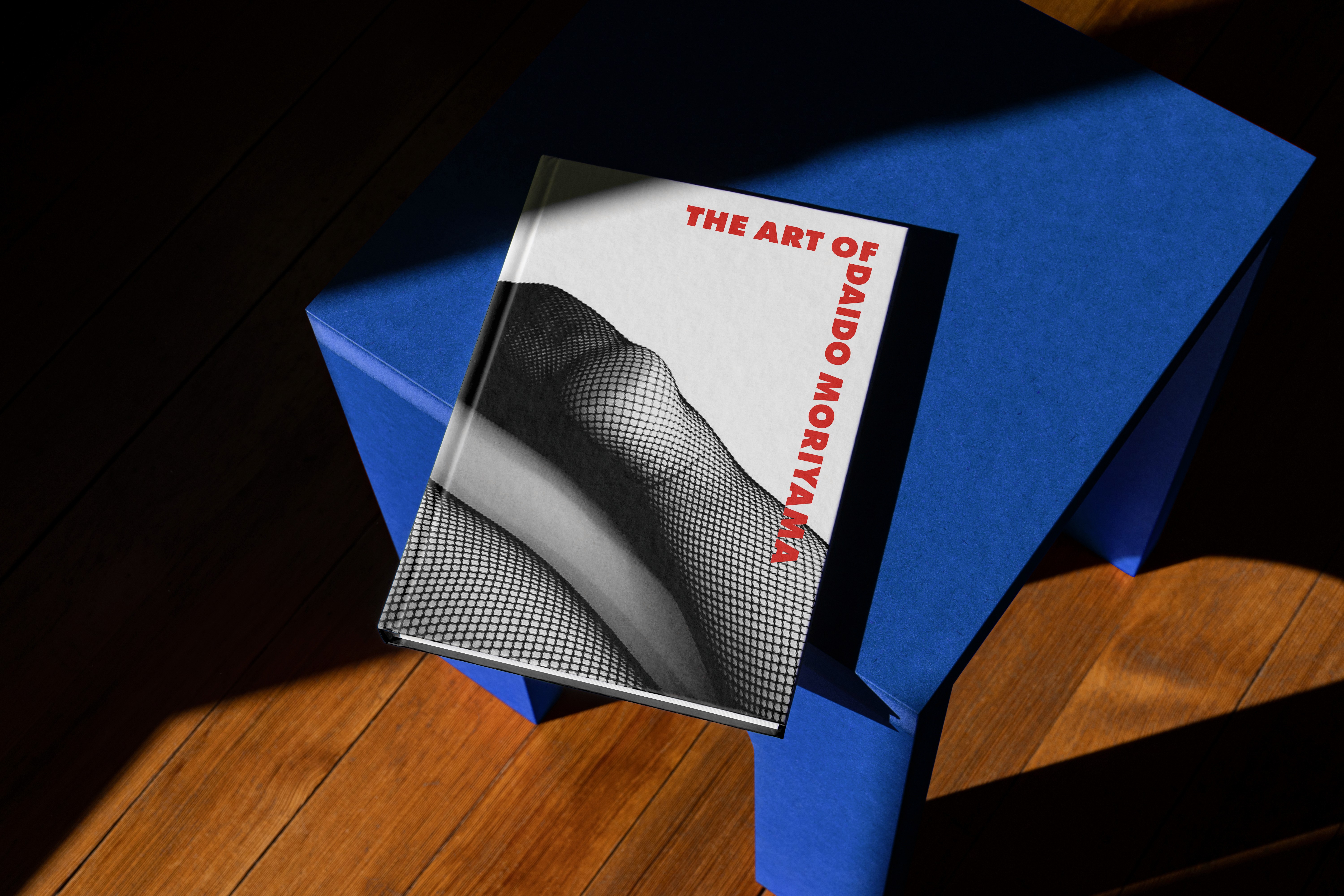 Stack of modern books and magazine with minimalist cover design on leather chair