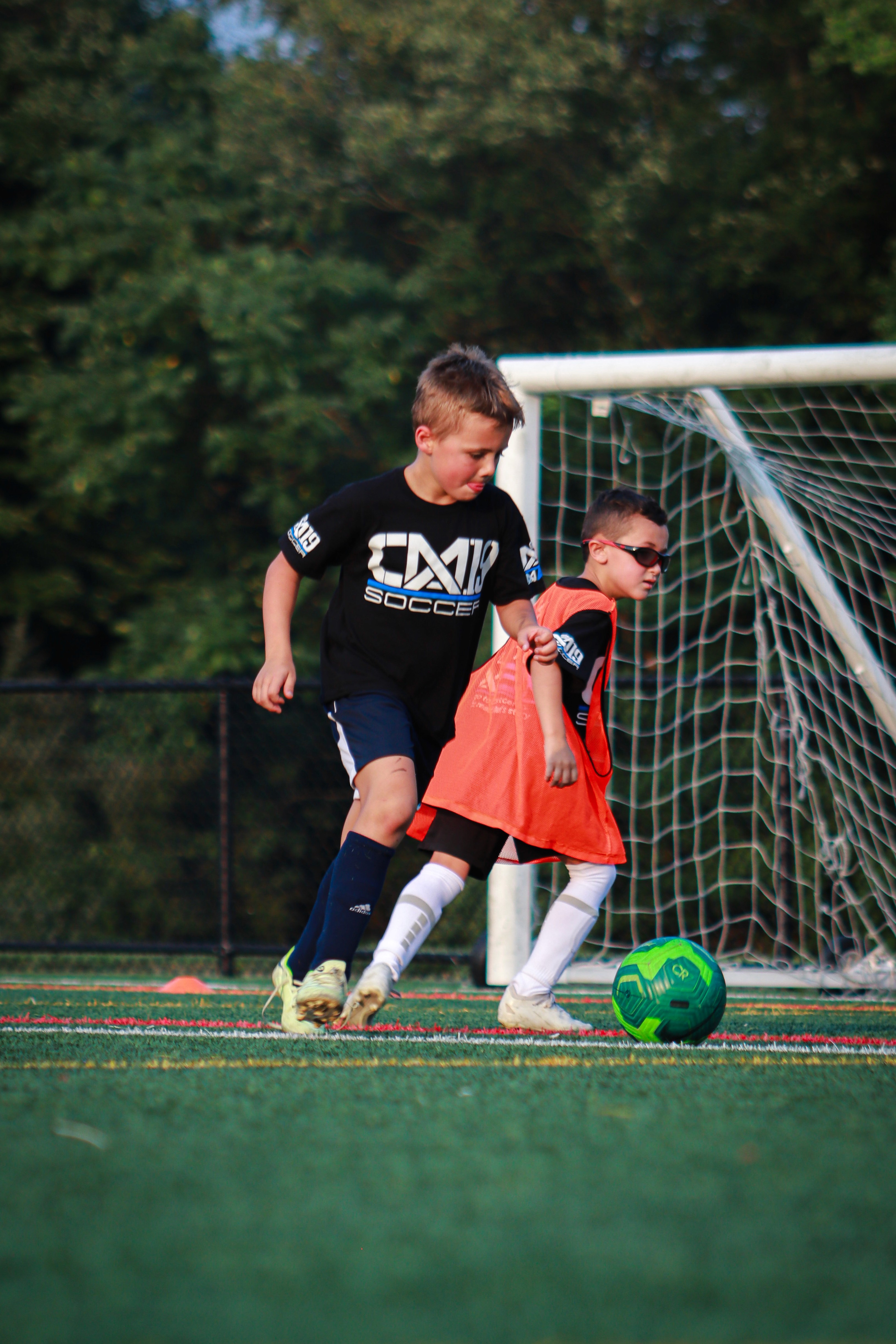 CM19 soccer player training beside the goal during an outdoor session.