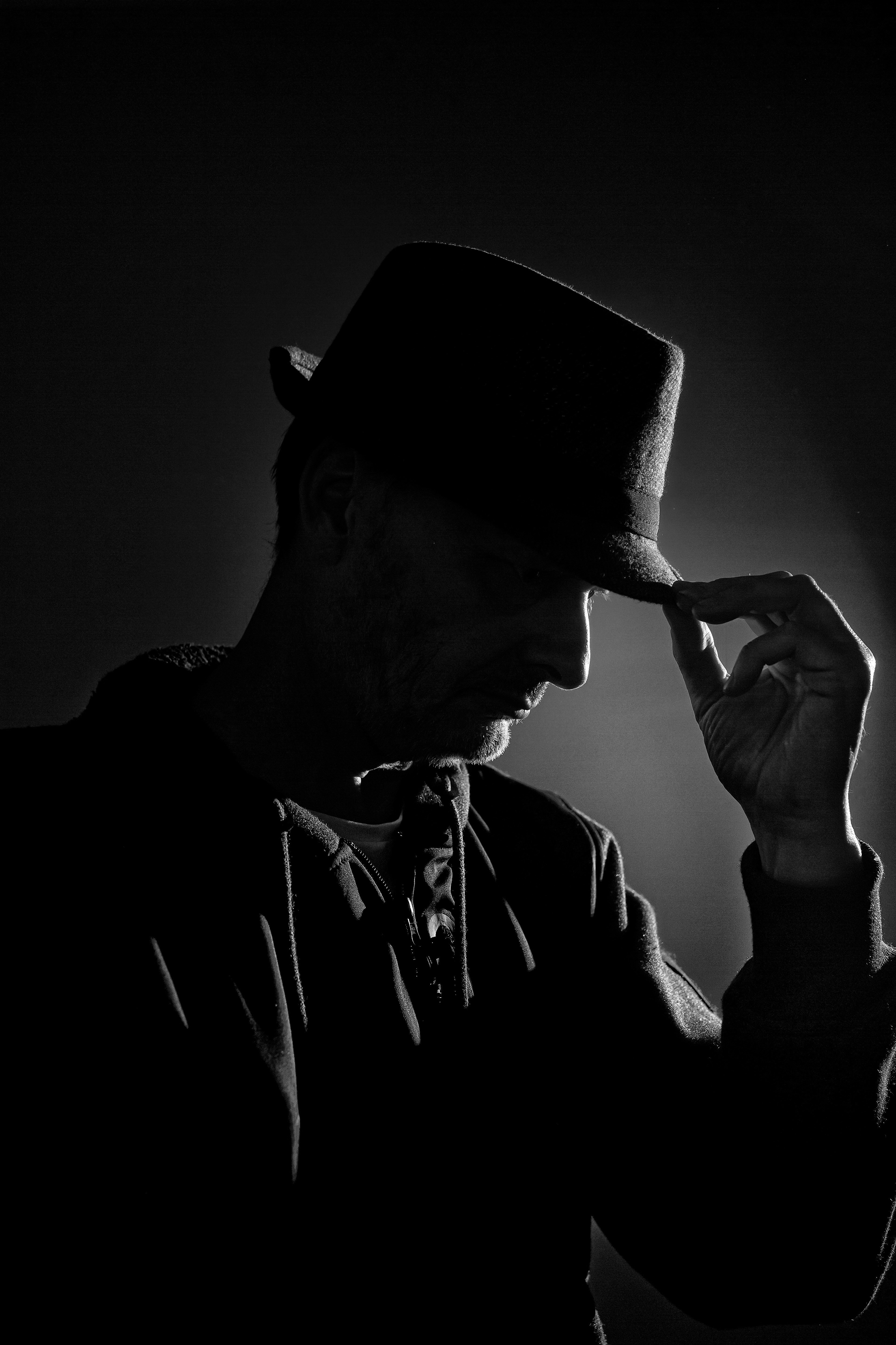 man in black hat and black coat