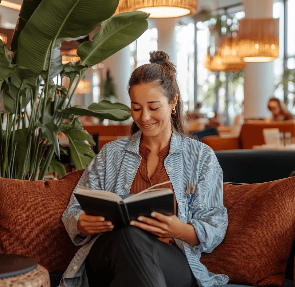 Woman Reading in Café