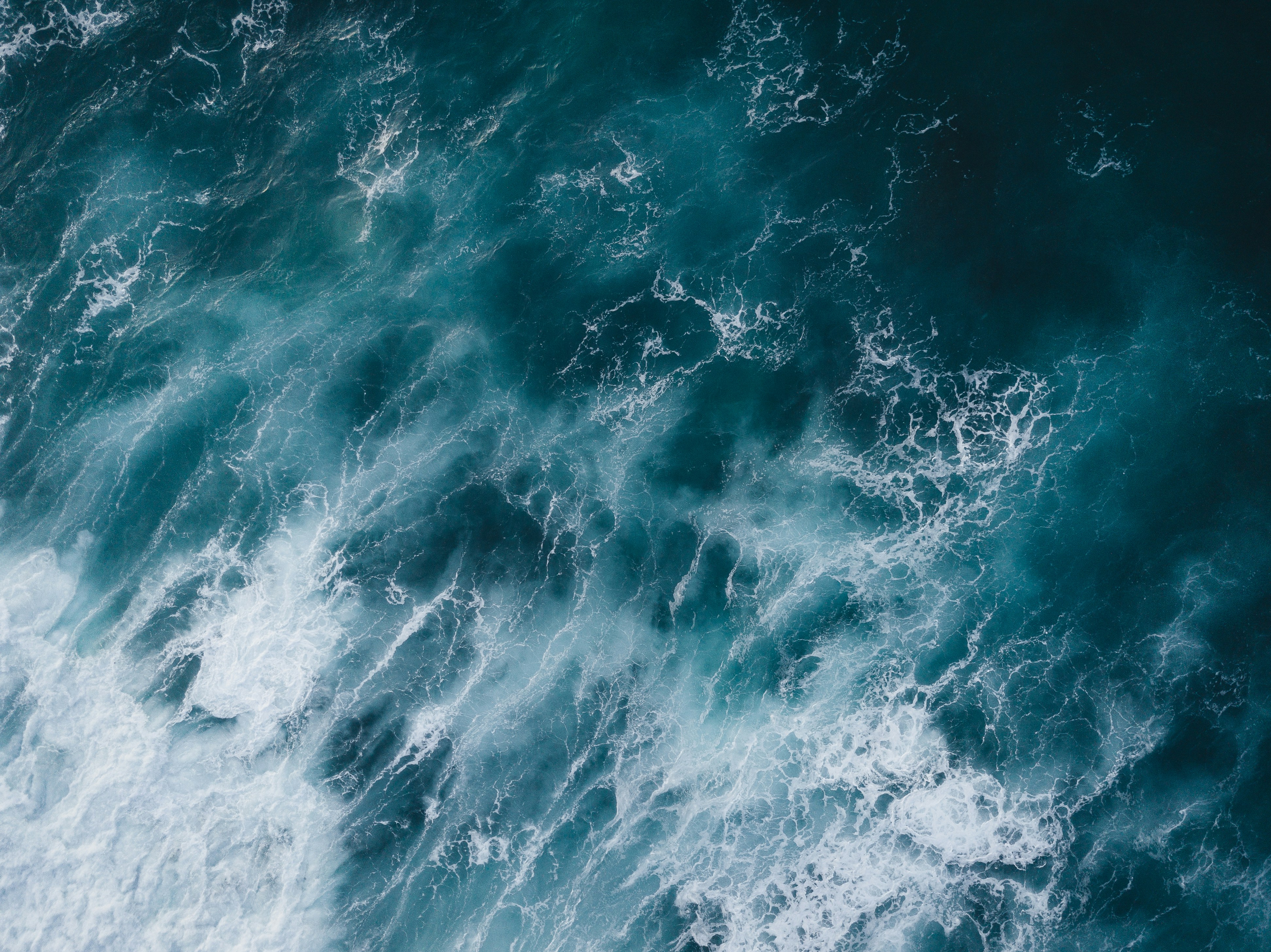 water waves on blue ocean water during daytime