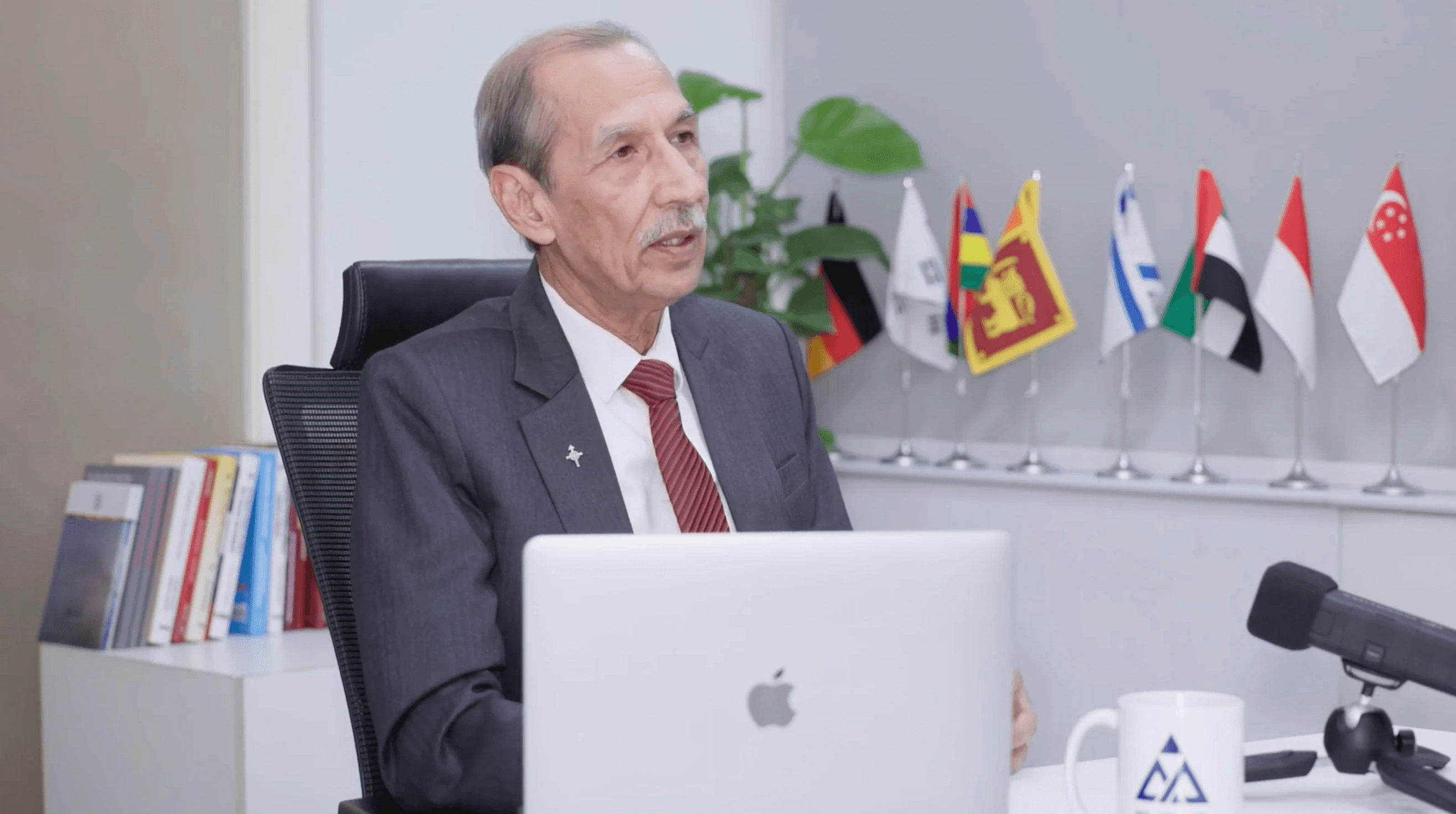 black quadcopter drone flying over snow field during daytime