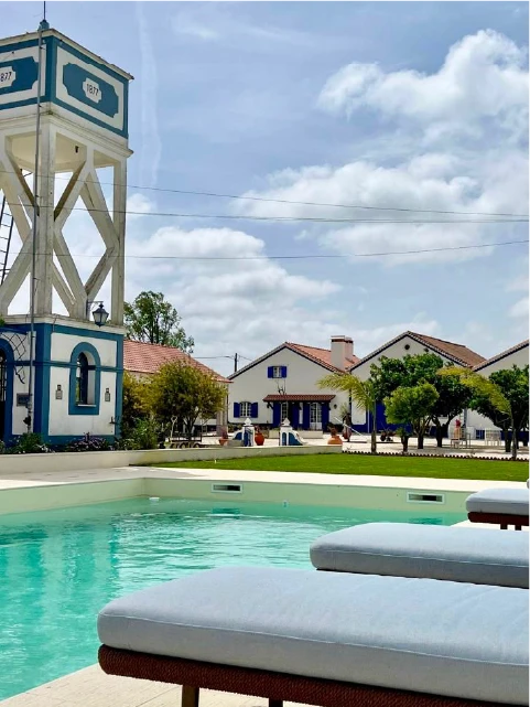 two lounge chairs near swimming pool