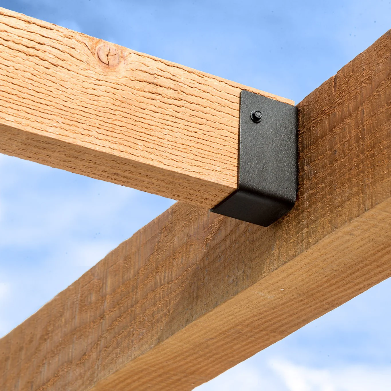 Macro photograph of light, textured wool fabric with soft shadows highlighting the natural fibers.