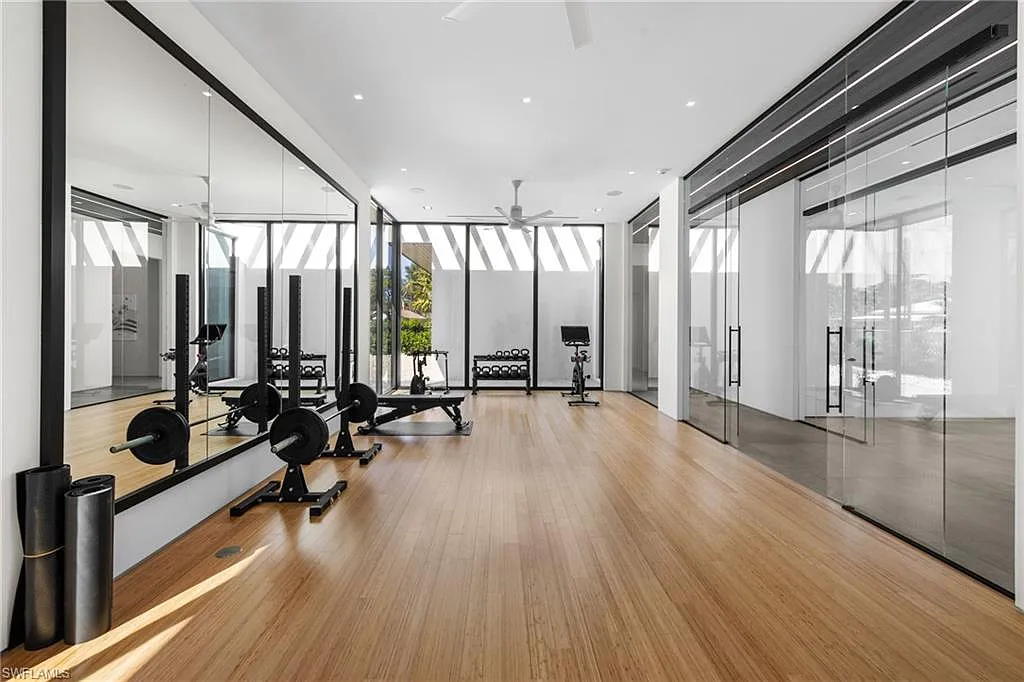 Indoor gym with premium equipment and floor-to-ceiling windows