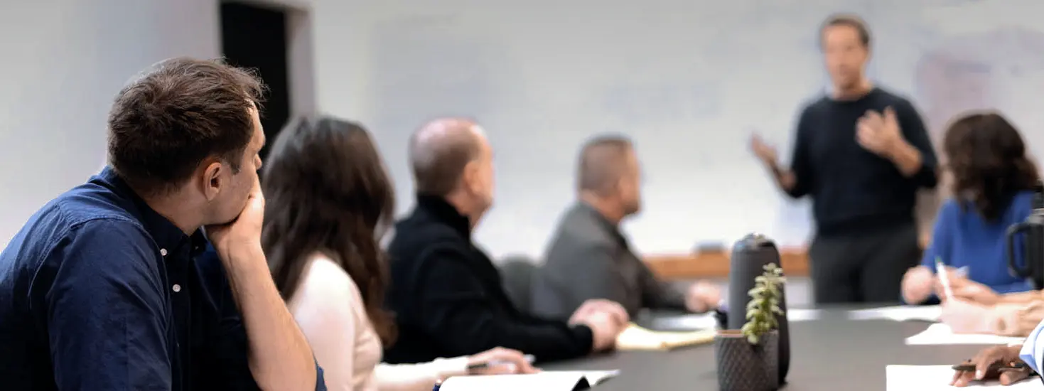 Church Growth Consulting company meeting with staff around a table in a conference room