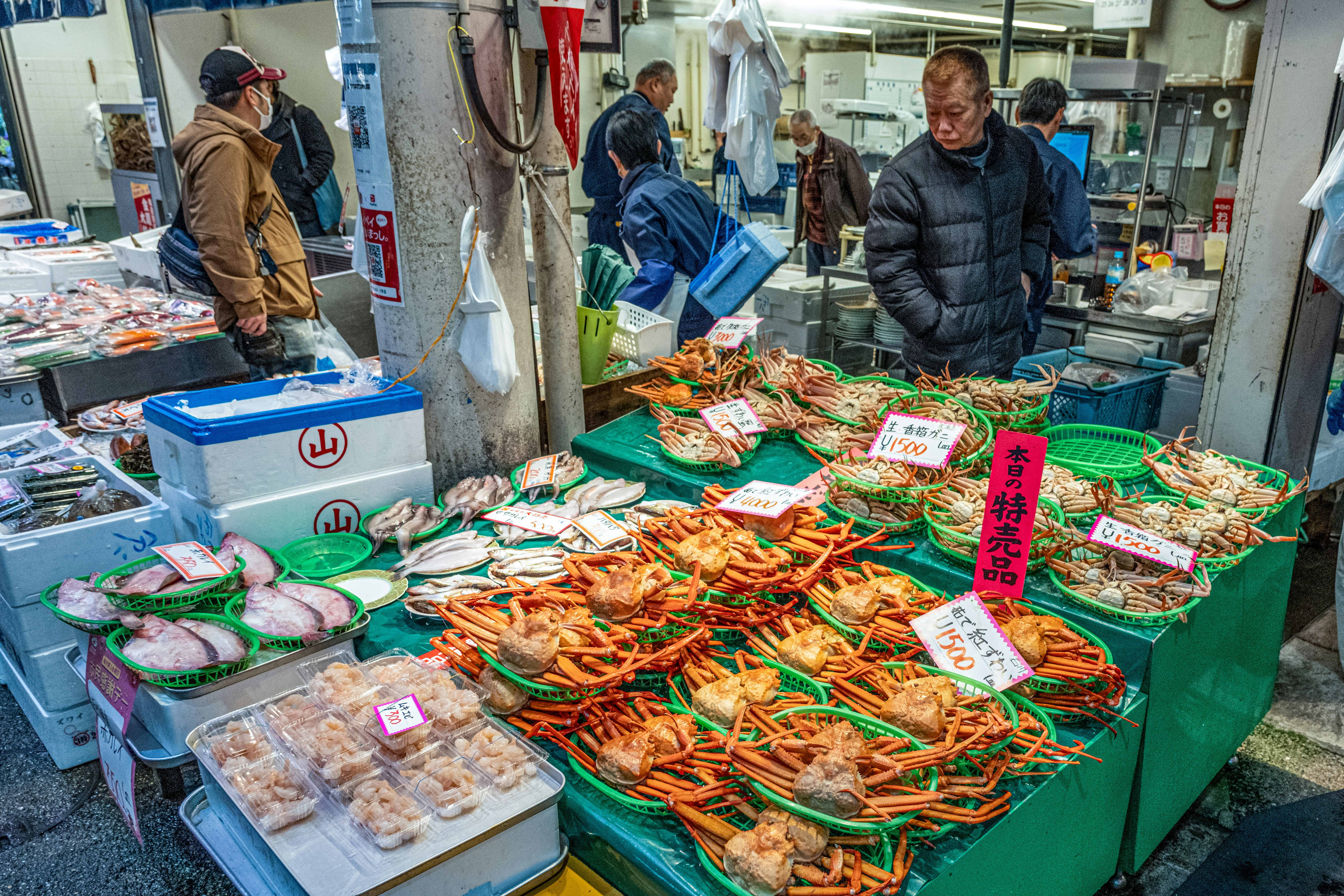 Fresh seafood displayed at an outdoor market stall.