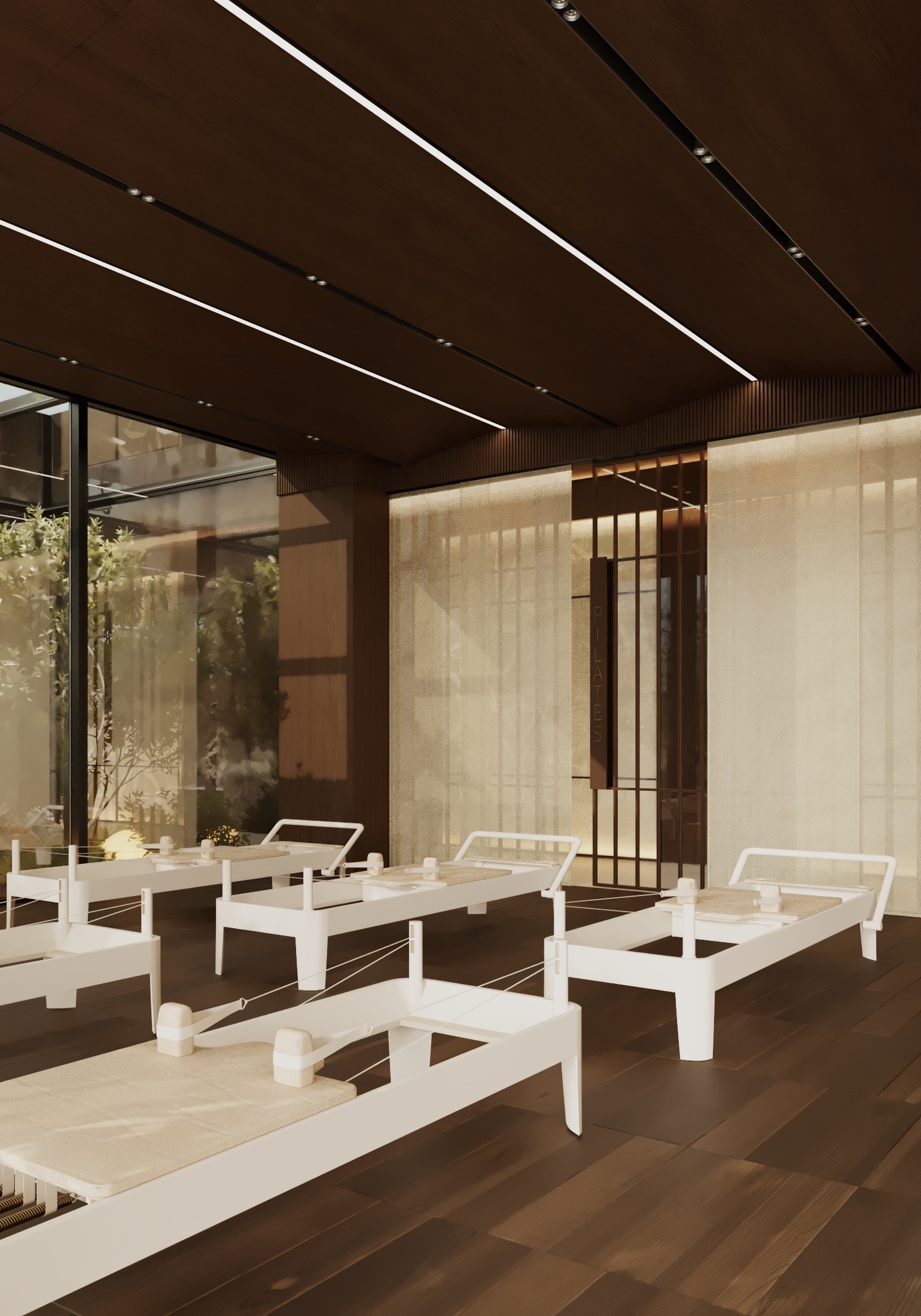 Minimalist interior space with wooden flooring and white furniture under a dark ceiling. Natural light flows in.