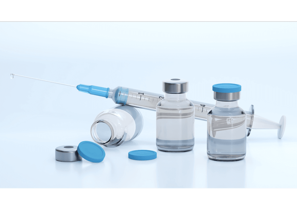 a person in blue gloves holding a toothbrush