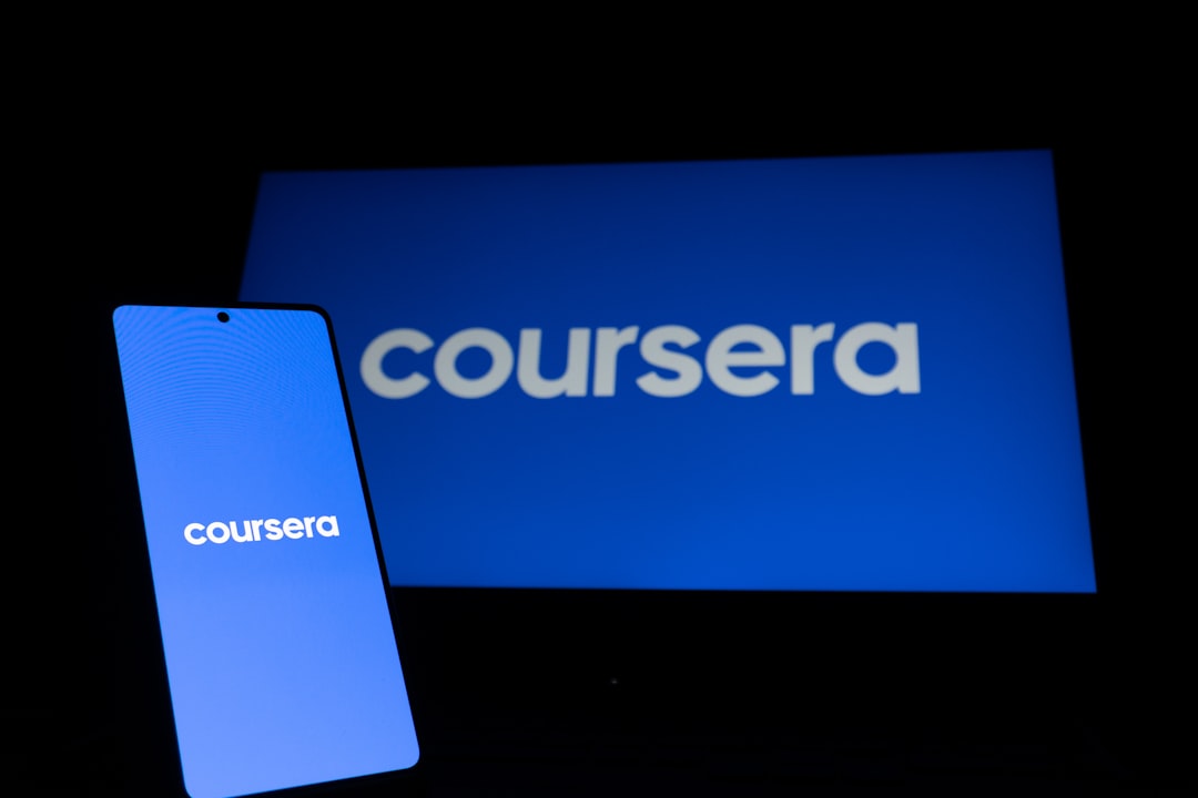Coursera logo on phone and laptop screen