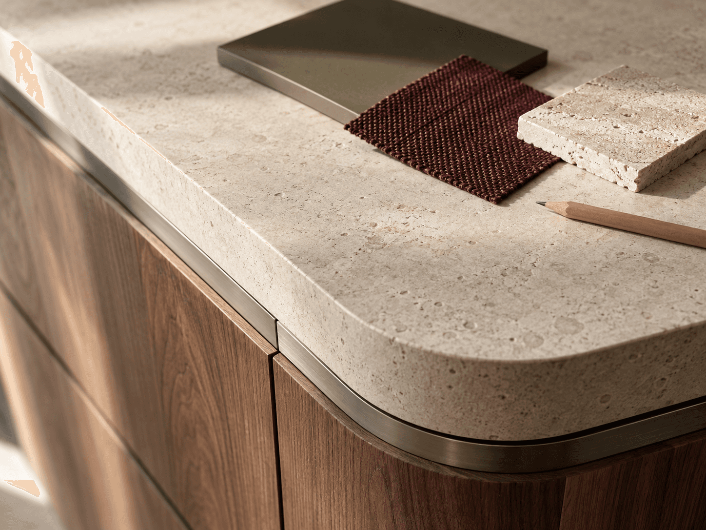 Close-up concept study of tactile stone, timber grain and a carefully finished kitchen detail.