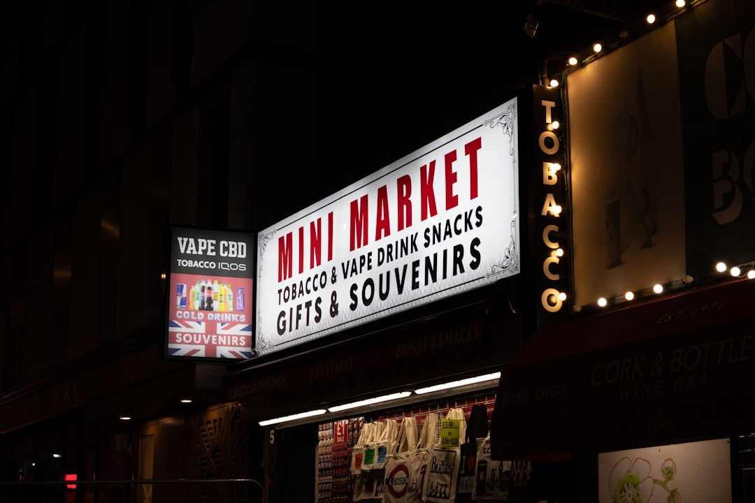 Mini market sign at night with lit bulbs
