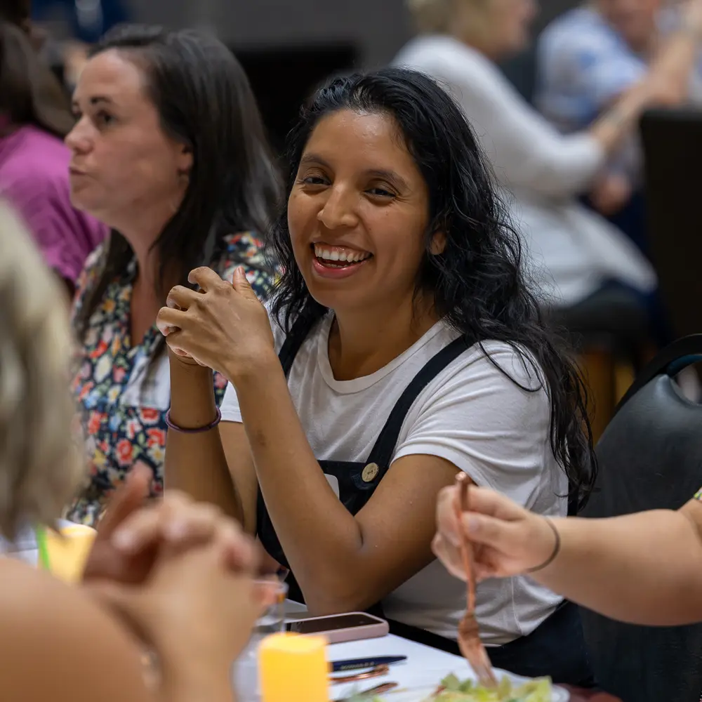 Lady smiling at Refresh At The Table