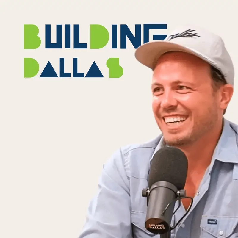 guest speaking into microphones with “Building Dallas” branding