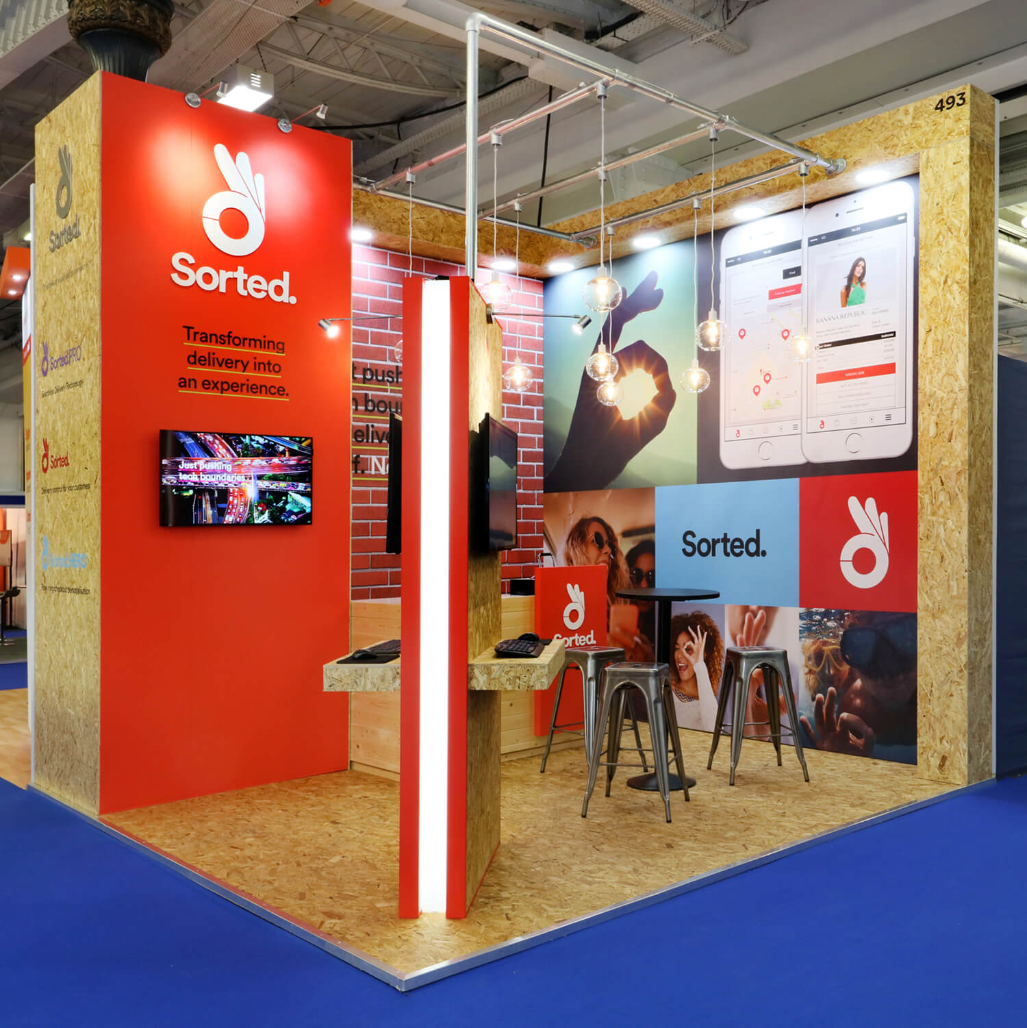 Sorted exhibition booth with branding and digital displays