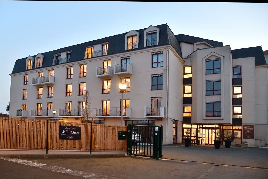 Modern residence exterior with clean architectural lines	multiple levels	and accessible ground floor entry