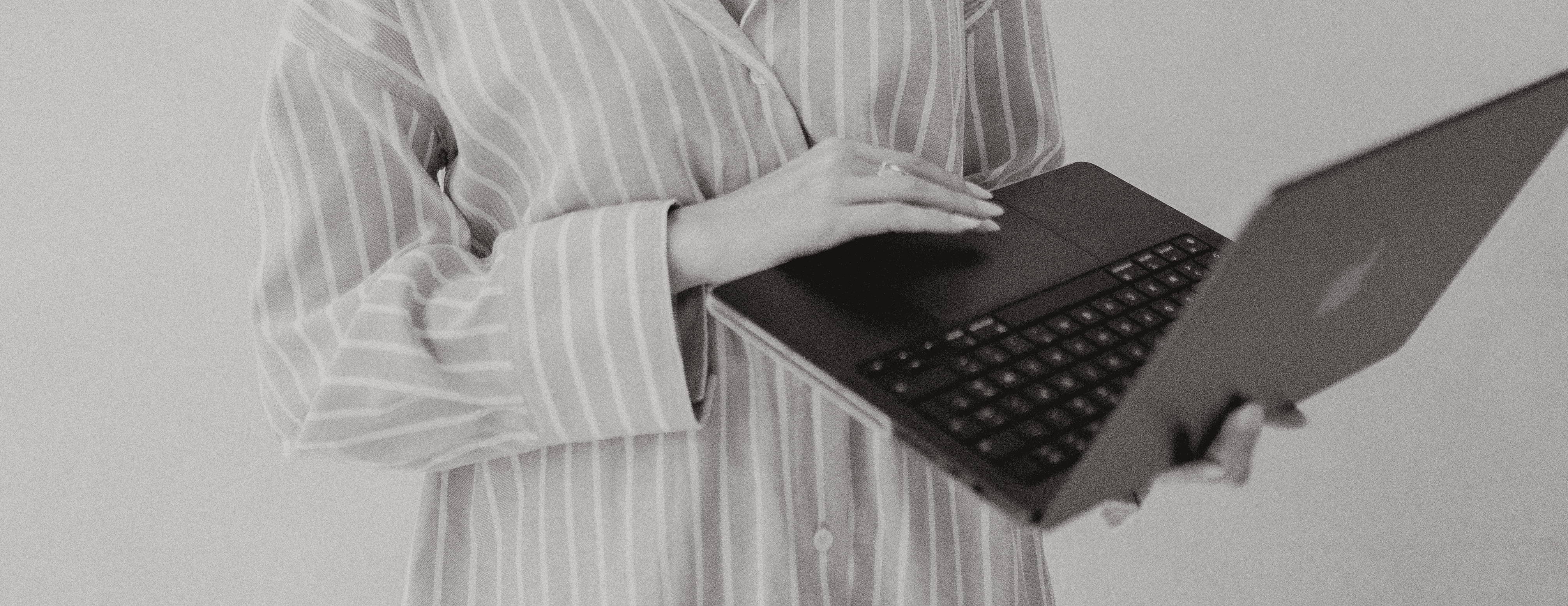 man in black shirt sitting in front of computer