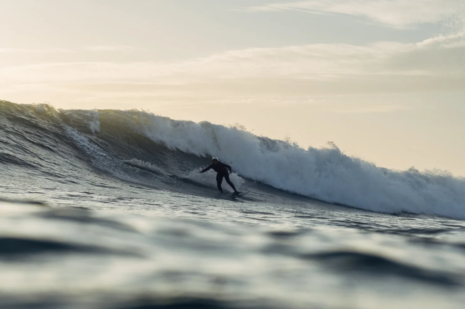 Surfer riding a huge wave