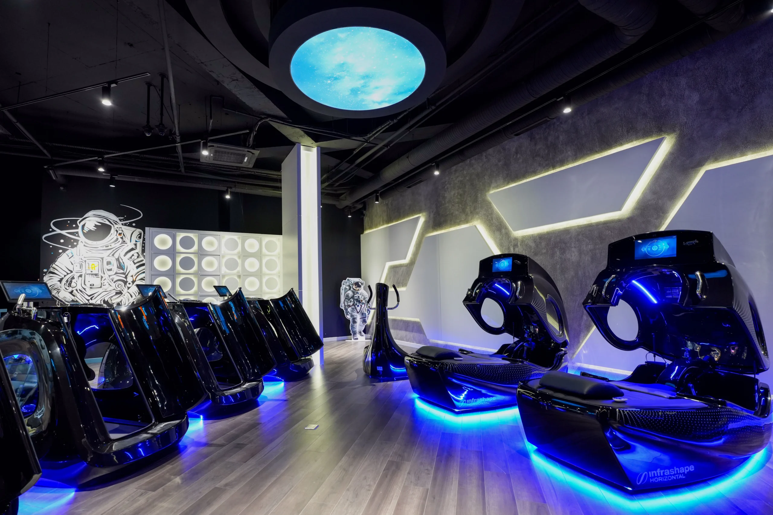 grayscale photography of woman on elliptical trainer