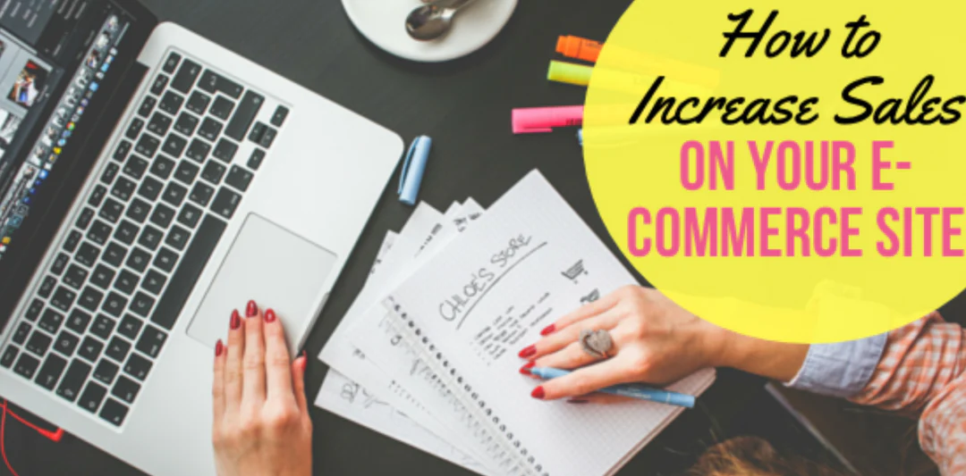 person working on notes on a laptop and notebook