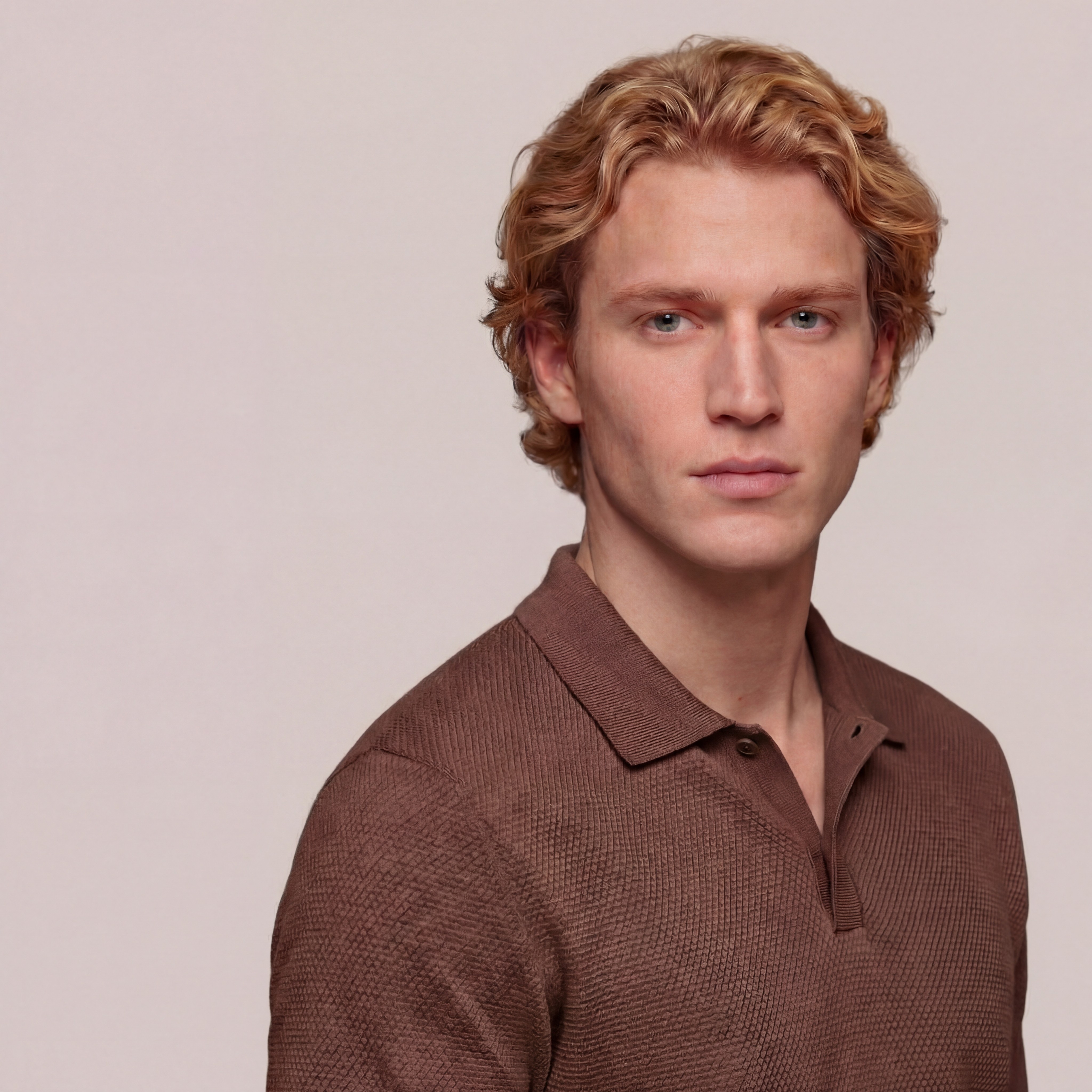 A girl with greenish eyes in yellow background