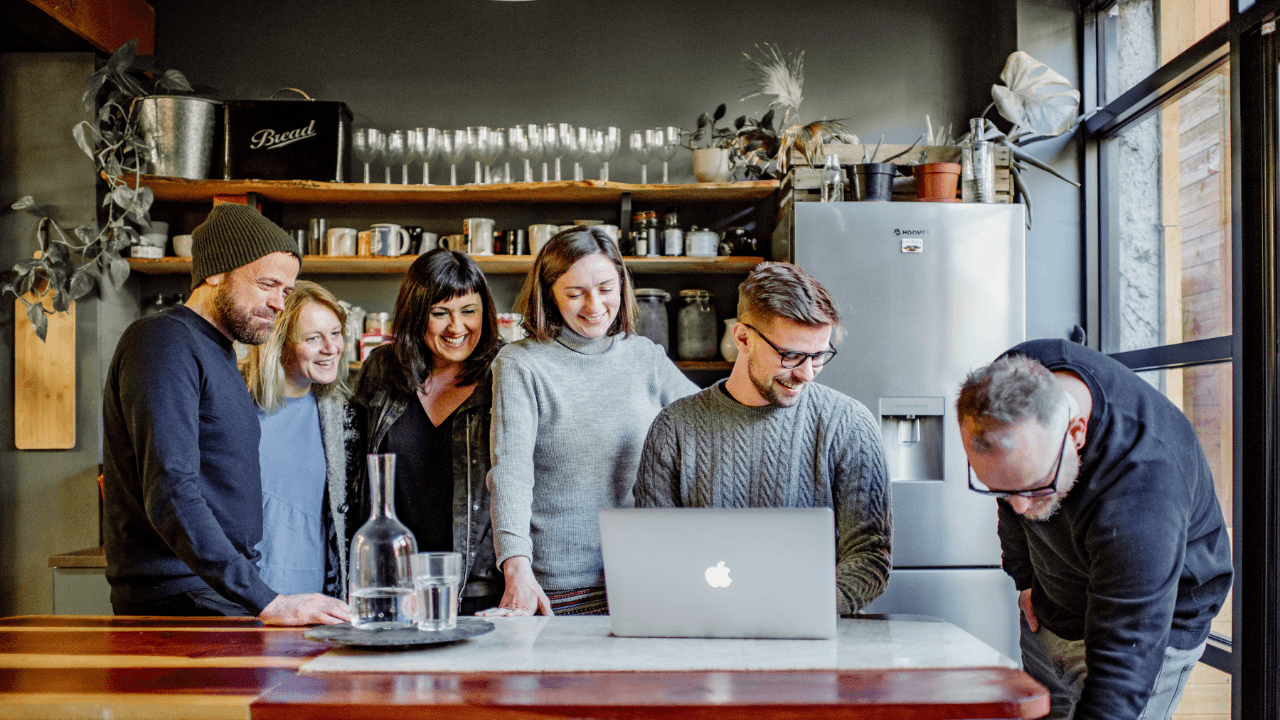 Tribers and Dani gather in the kitchen at Tribe Porty.