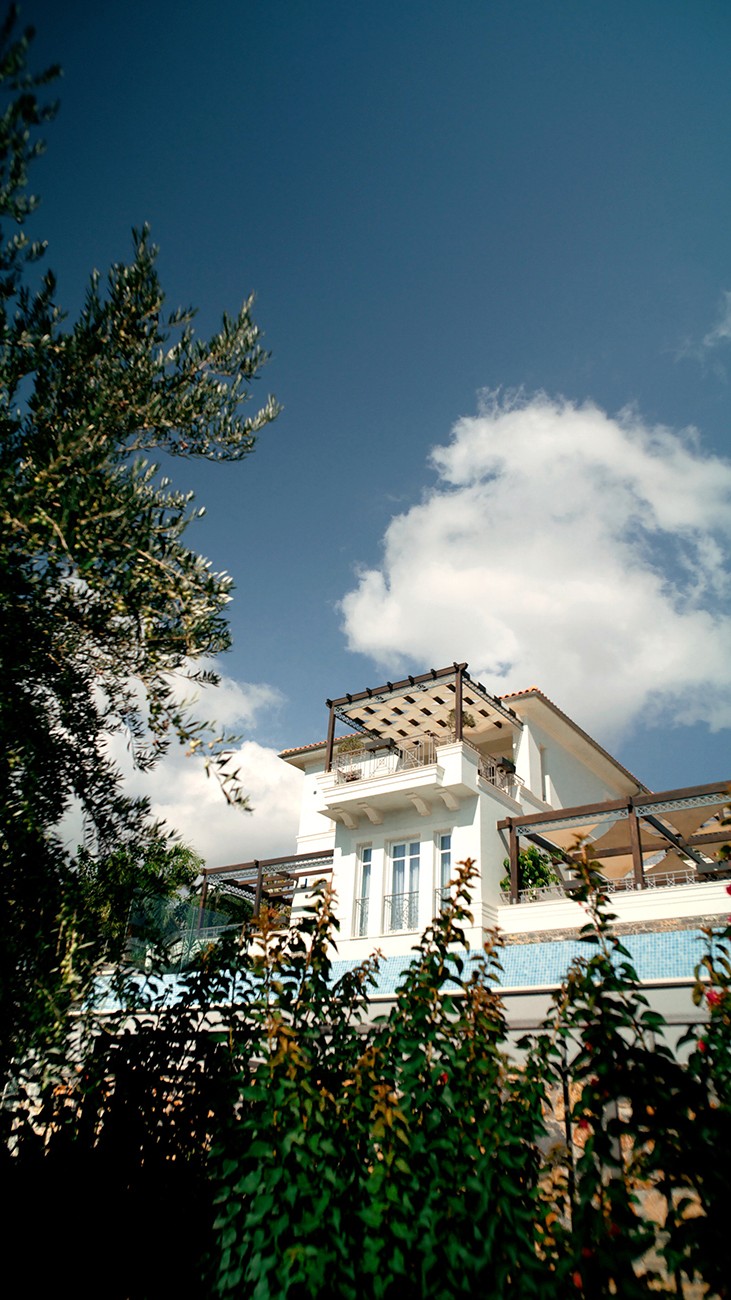 Villa exterior, golden hour.