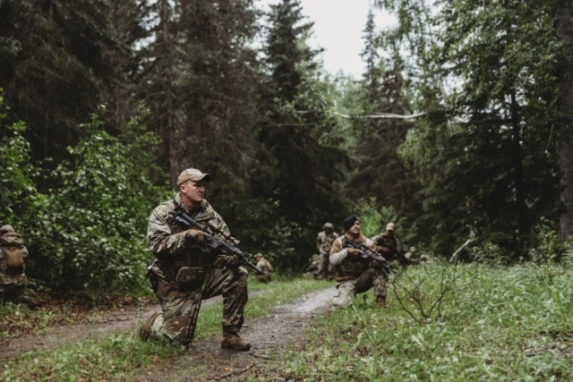 Infantry squad at the edge of an open danger area, deciding whether to bypass it or cross it