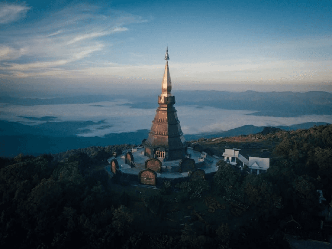 bird's-eye view of white temple surround by trees