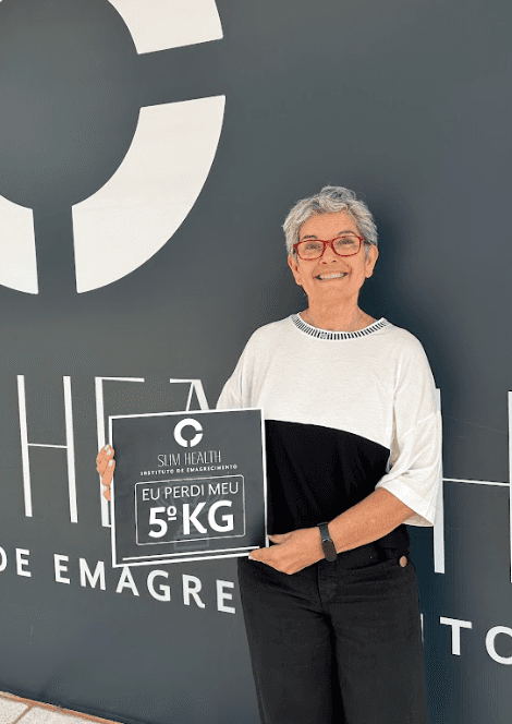 Close-up of a tree stump showing growth rings and a textured brown wood surface.