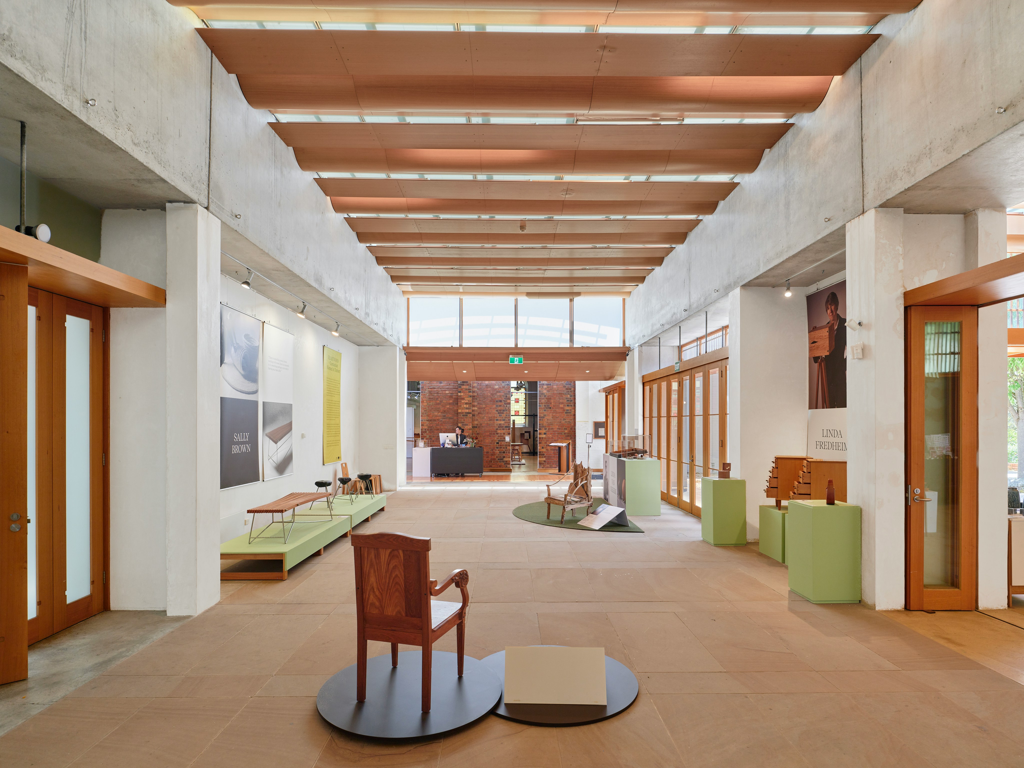 Modern interior design with wooden accents and exhibits.