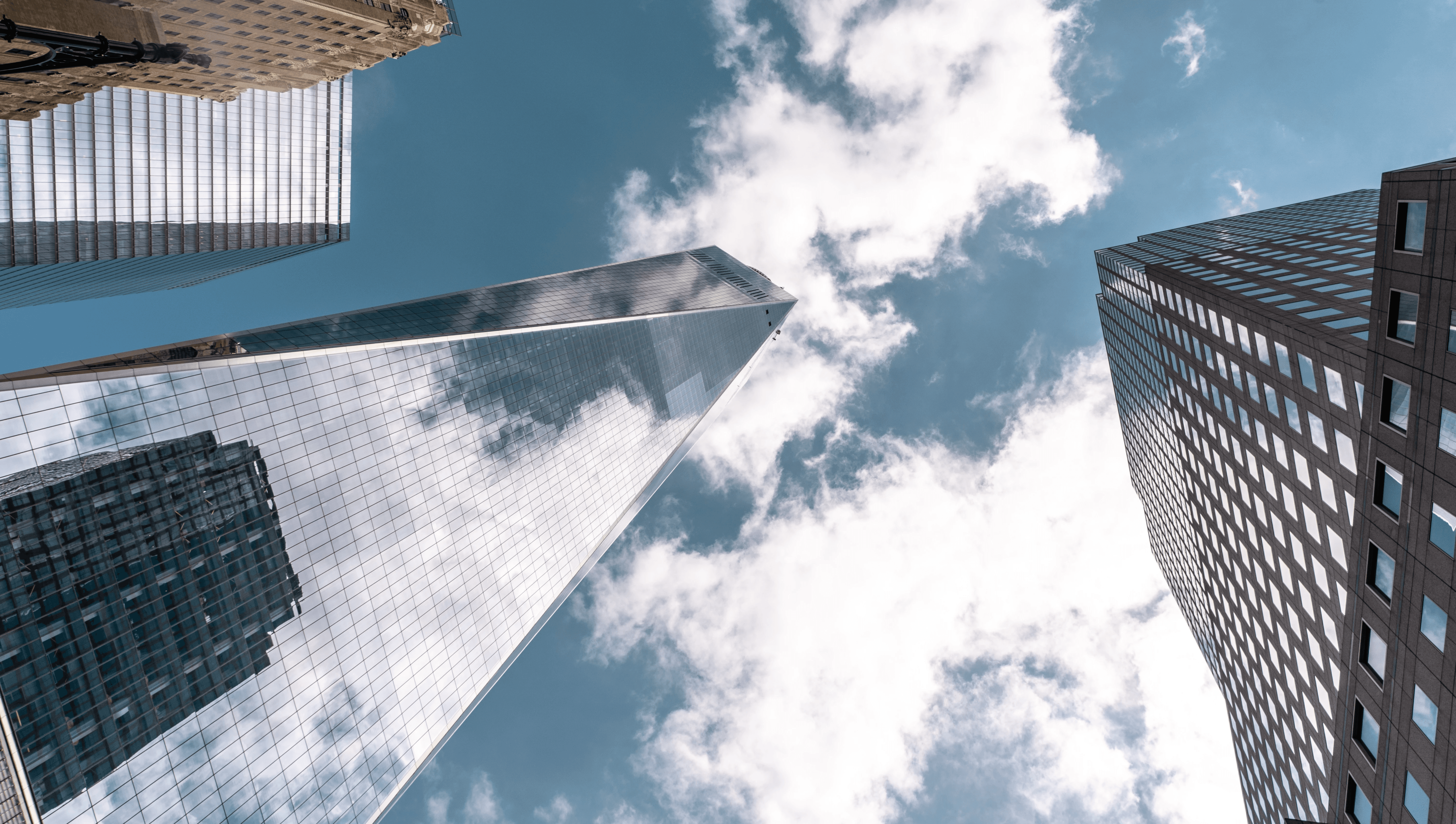 Executives and professionals in a bespoke corporate training workshop, discussing strategy, compliance, and management systems in a modern meeting room.
