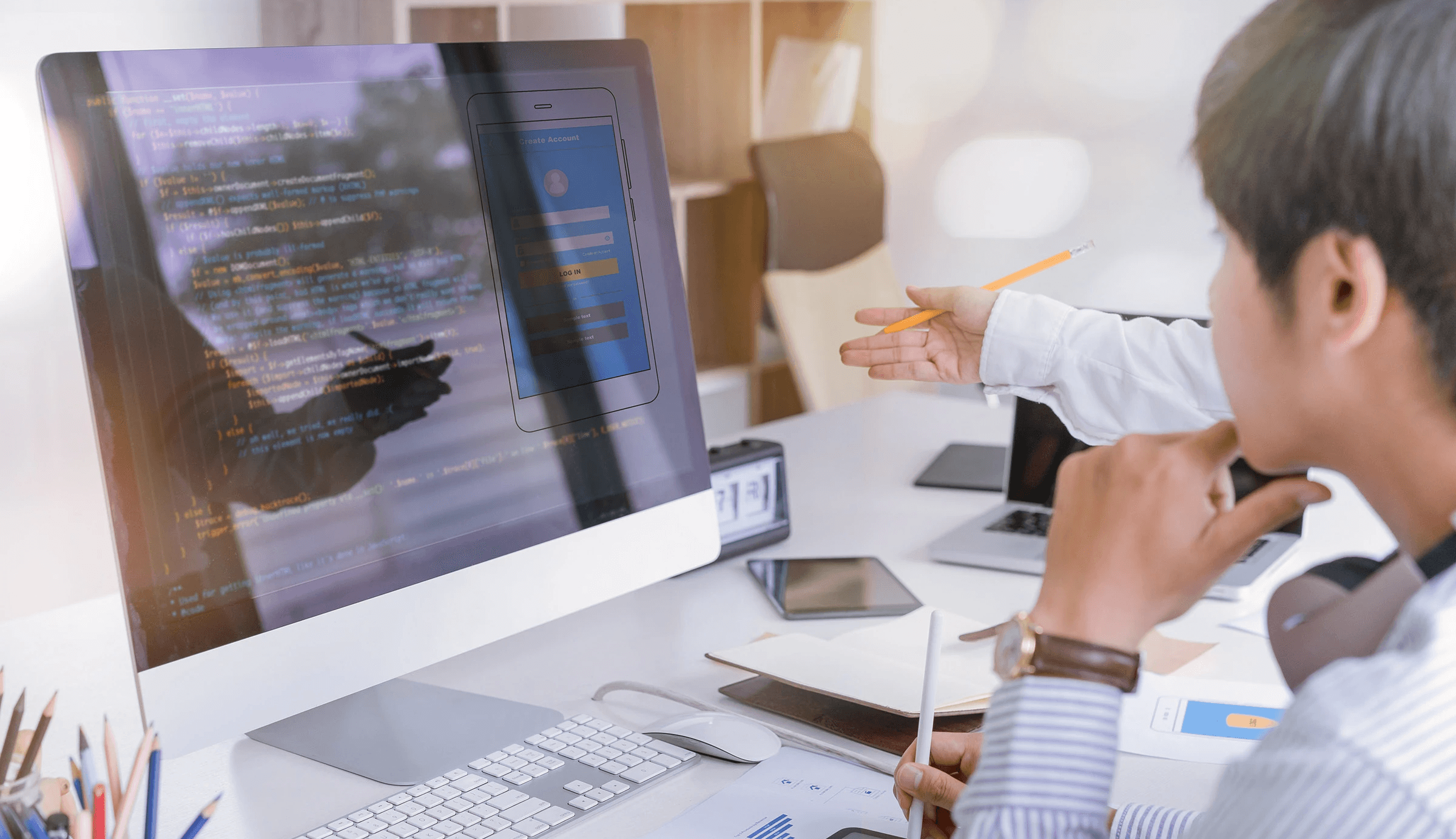 Team reviewing mobile app interface code - How to Hire a Front-End Developer