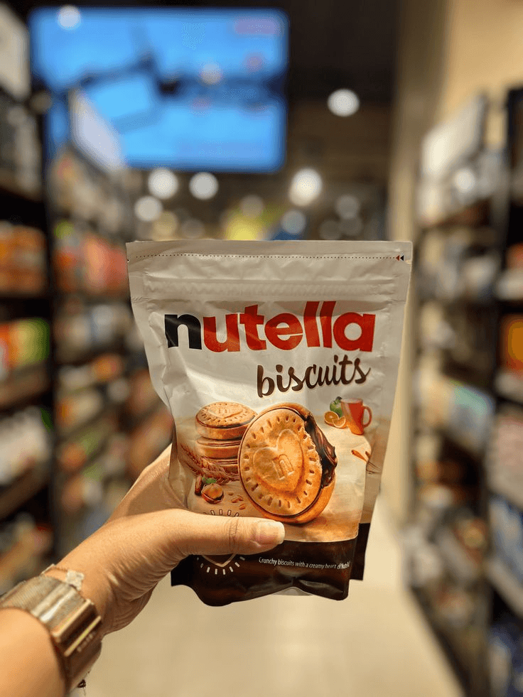 Hand holding a packet of Nutella Biscuits
