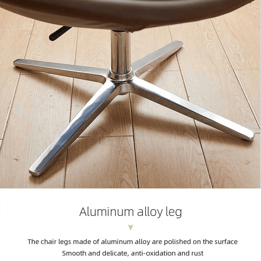 Close-up of premium aluminum alloy swivel chair base: five-star chrome-plated legs, highly polished surface, smooth delicate finish, anti-oxidation and rust-resistant, modern ergonomic lounge chair detail on hardwood floor