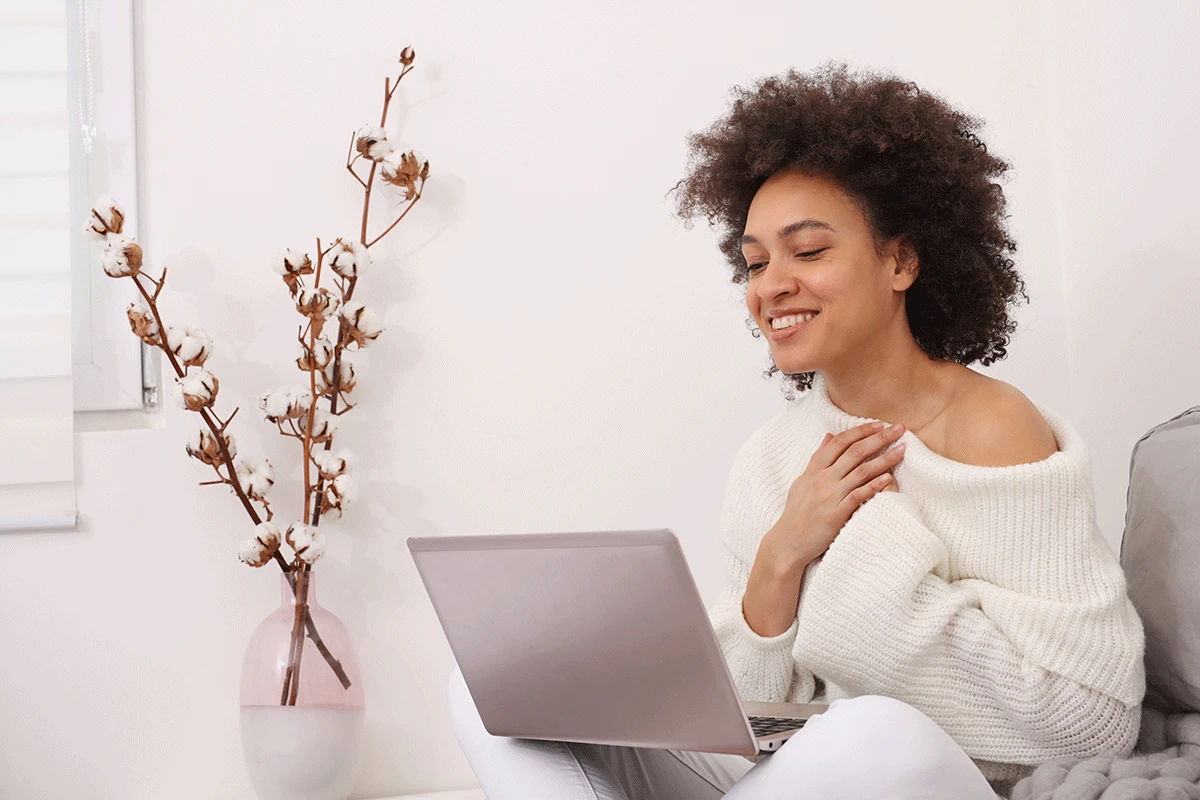 Woman speaking with a therapist during a telehealth counseling video call
