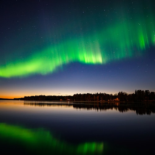Northern Lights dancing in the sky above Lapland
