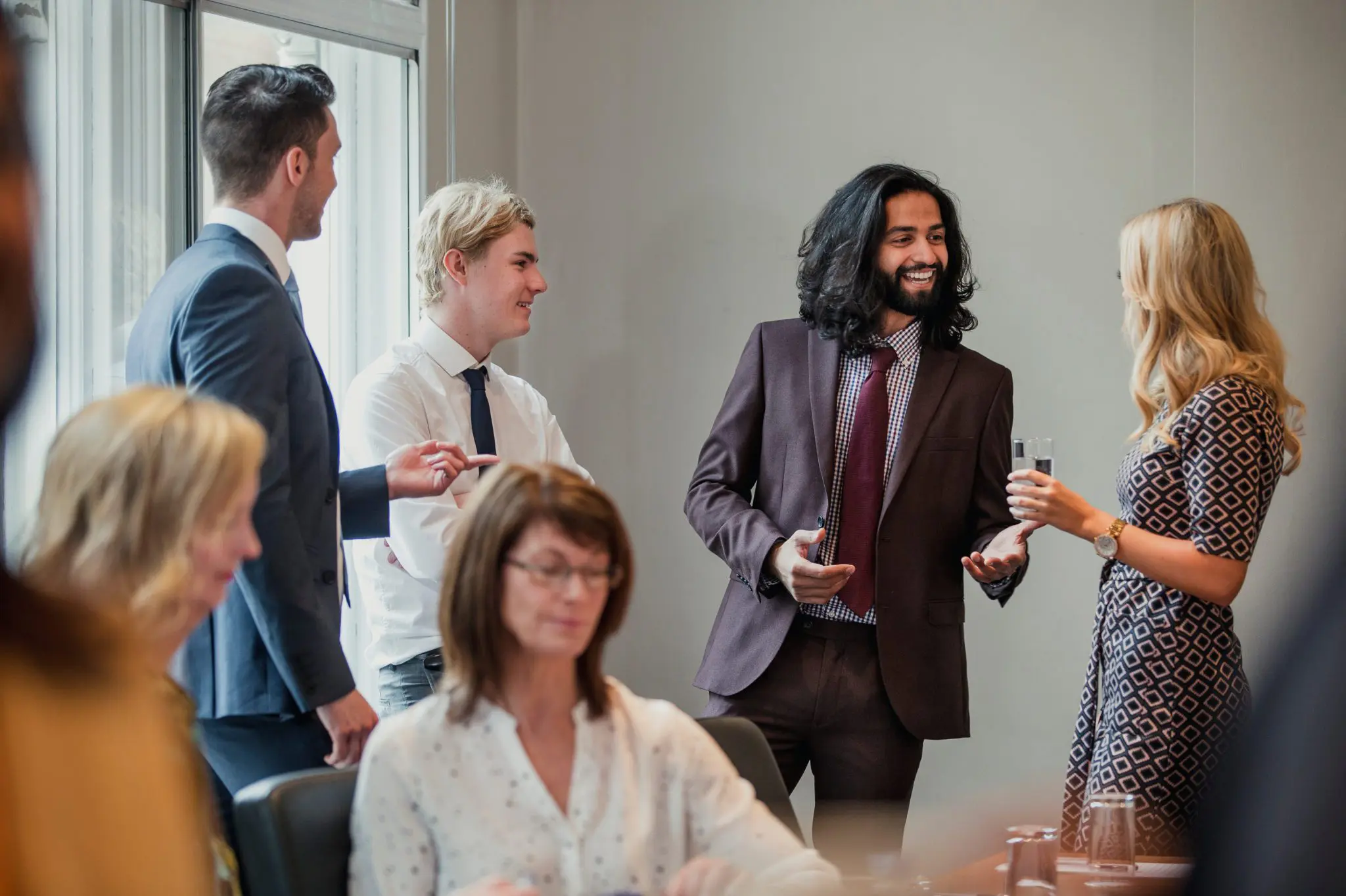 Young people in a room chatting