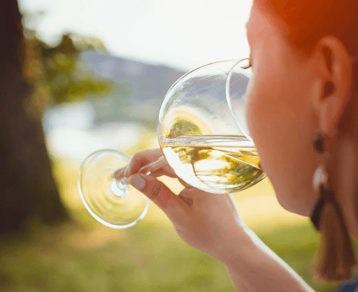 boy in white crew neck shirt holding clear glass bubble maker