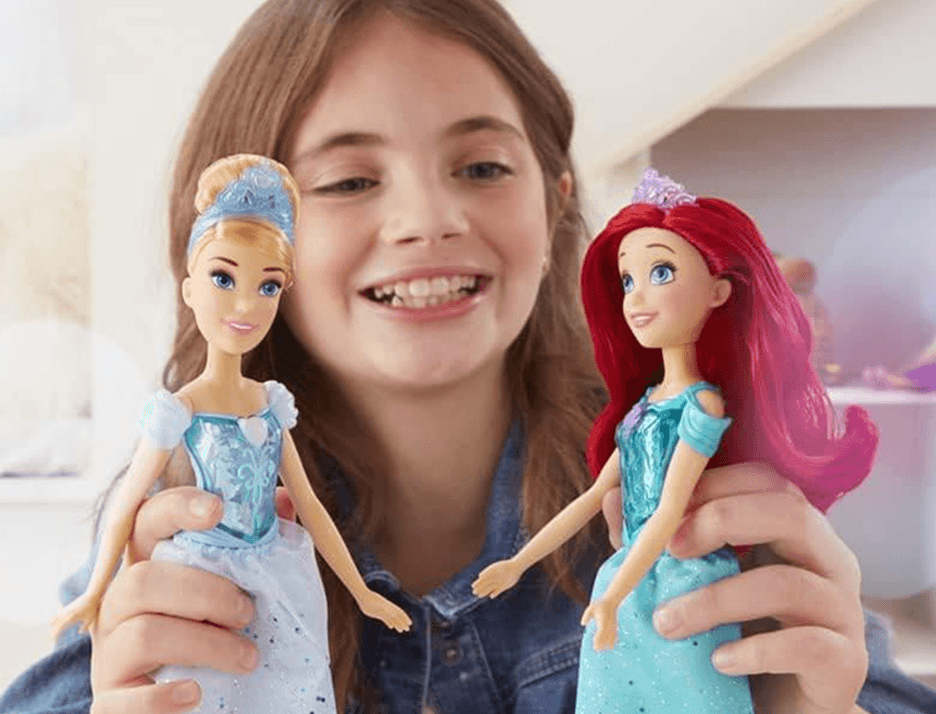 Young girl playing with doll characters