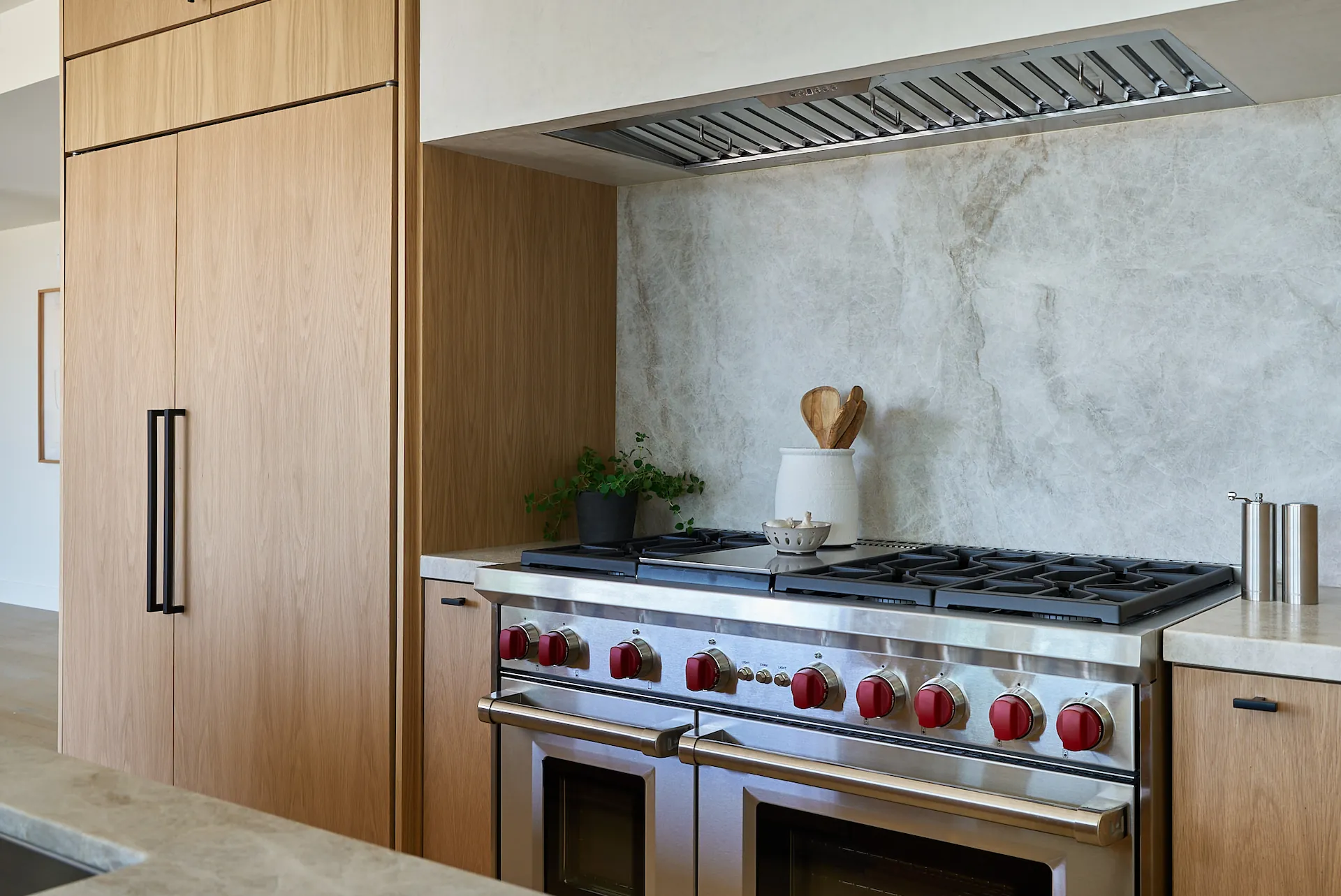 Close up of the cooking area with Wolf double oven and range. Photo by Todd Huge.