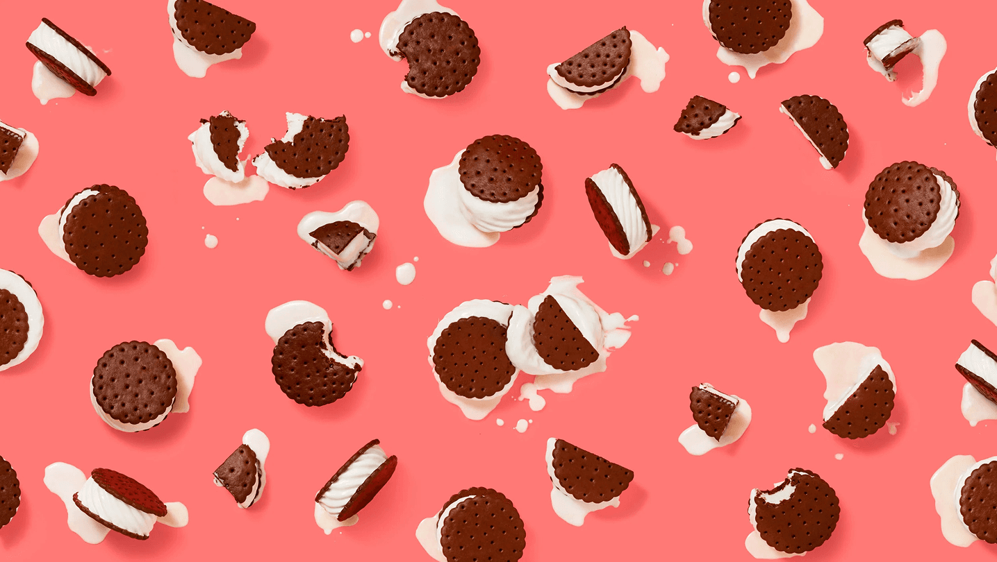melting ice cream sandwiches on pink background