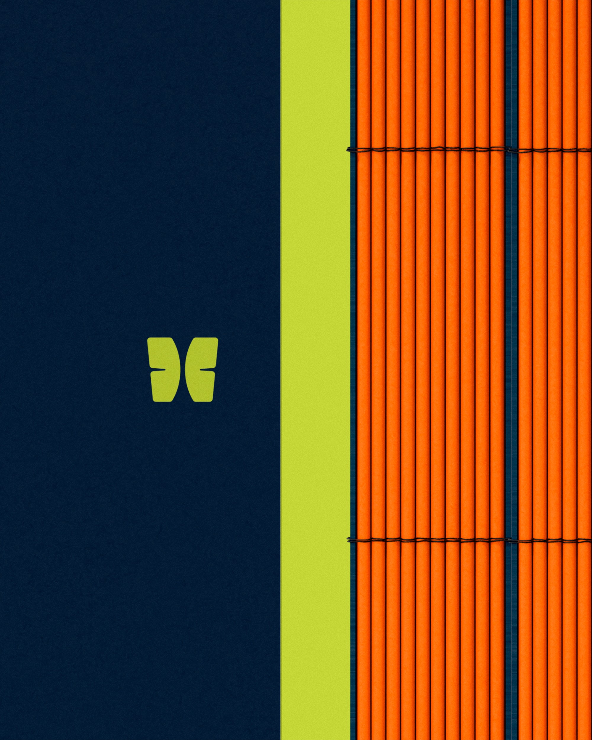 Close-up of the Trazando Futuros annual report showing the lime green logo on a navy cover beside bright orange bound page edges.
