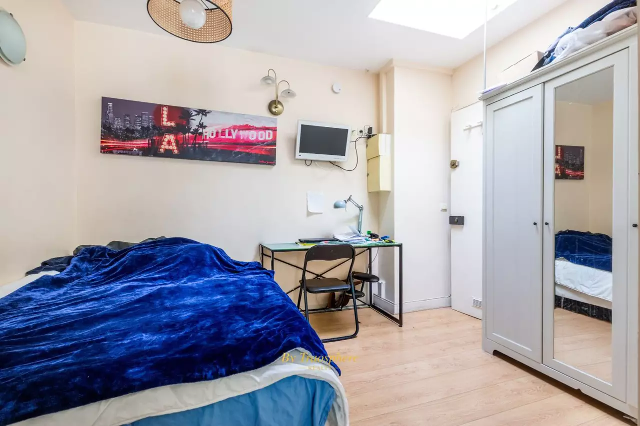 a kitchen with a sink and a stove top oven