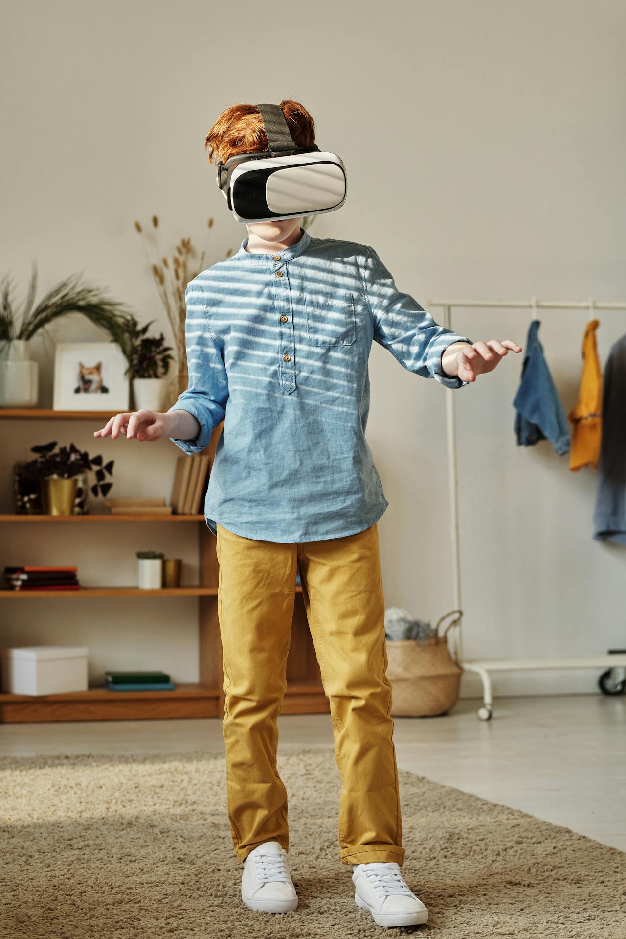 a boy wearing VR and watching something