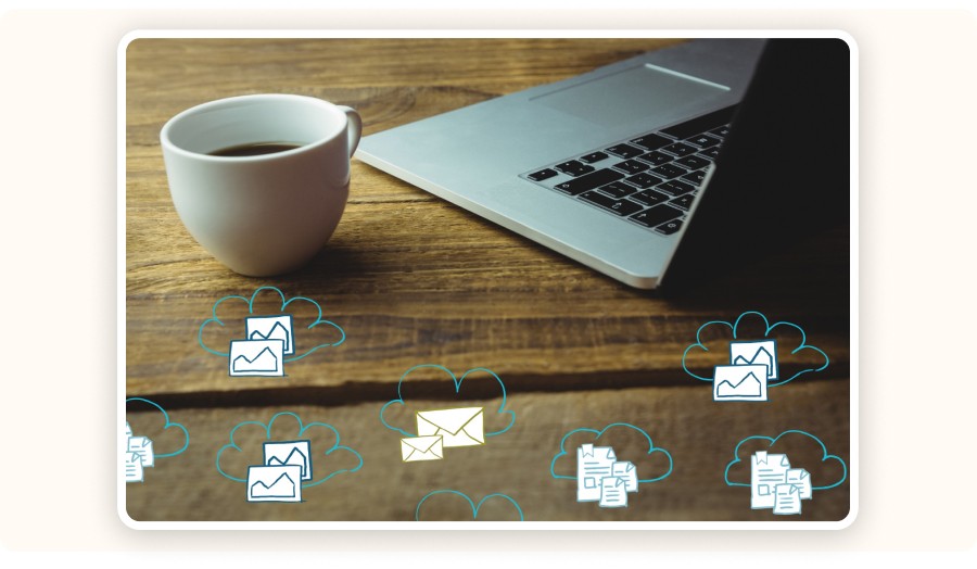 Laptop and coffee with cloud icons representing email and data.