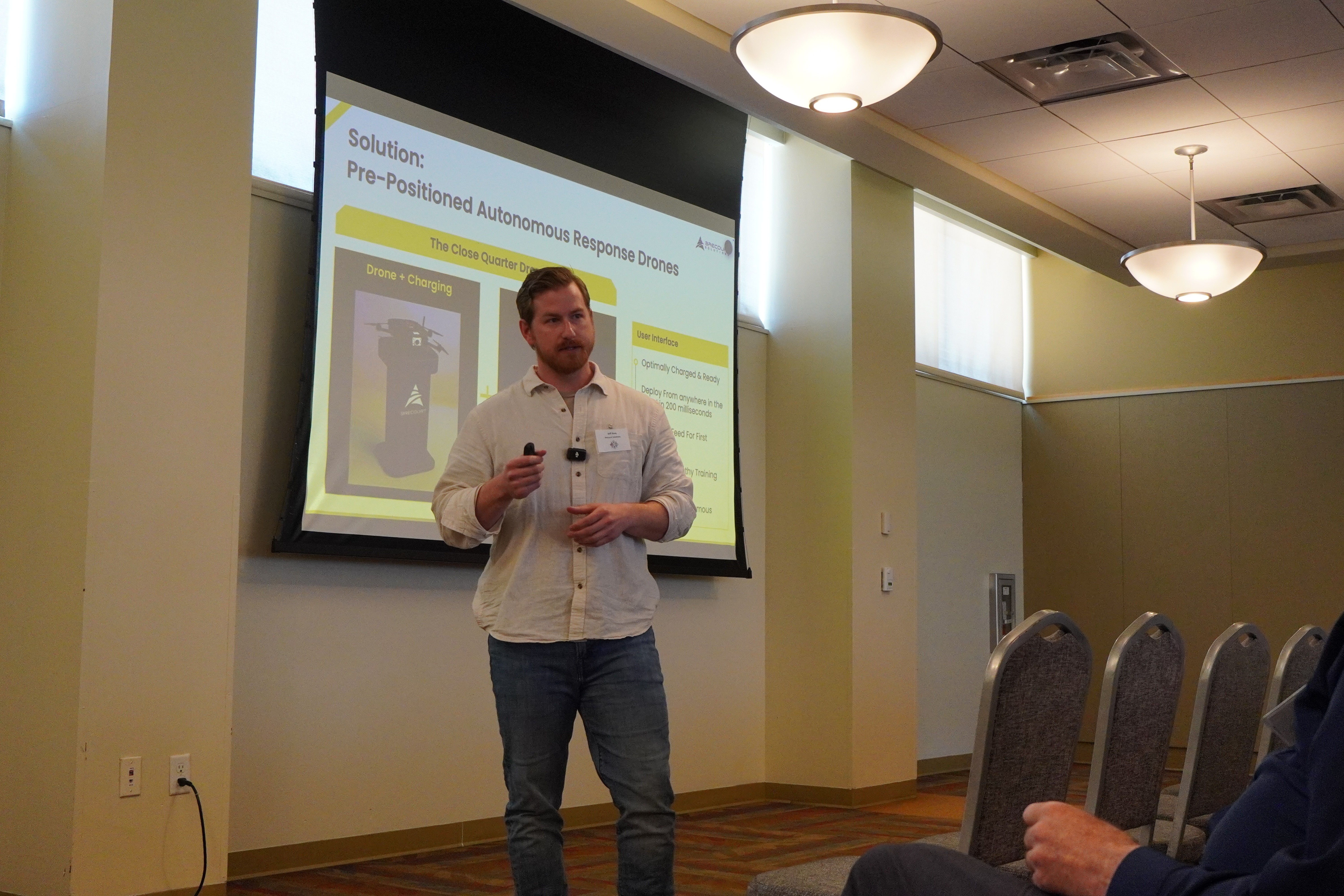 man standing in front of group of men
